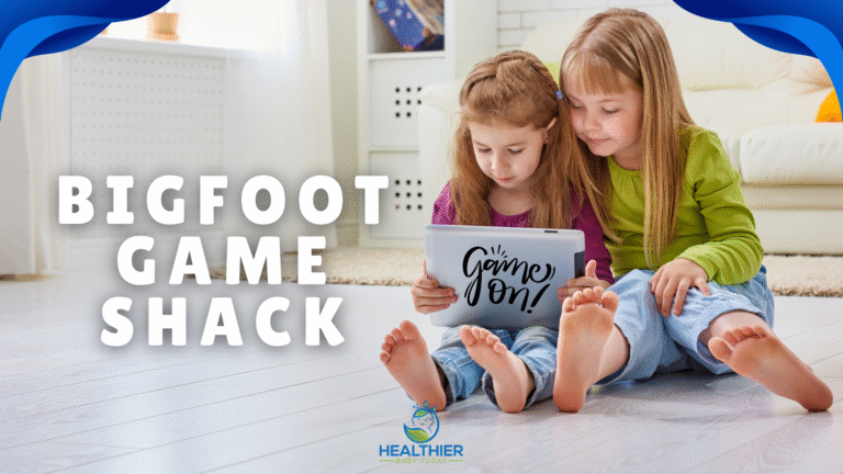 Two young girls sitting on the floor happily looking at a tablet with ‘Game On!’ on the screen, text reads Bigfoot Game Shack, Healthier Baby Today logo at the bottom // Healthier Baby Today