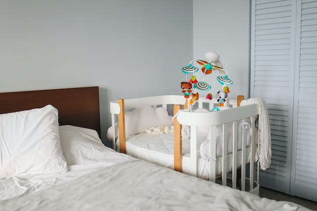 Infuse the nursery with playful wall art and soothing colors to create a visually stimulating environment