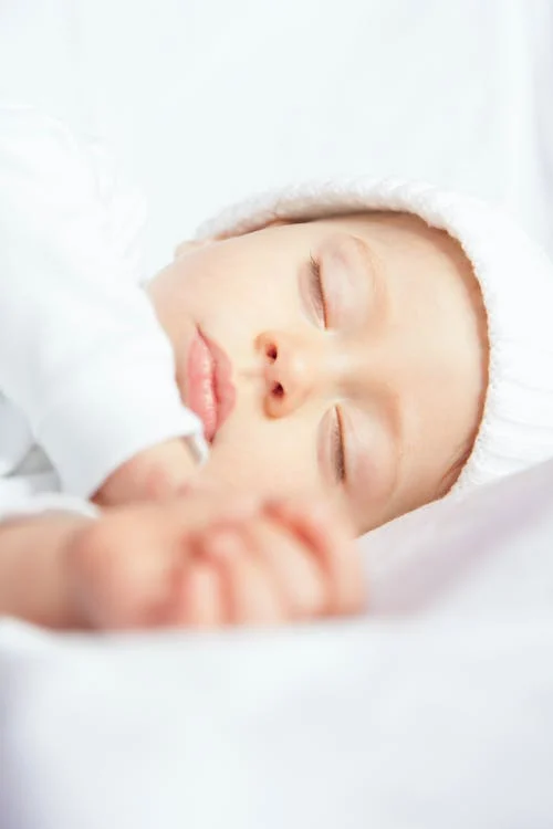 Baby Sleeping, white covers // Healthier Baby Today