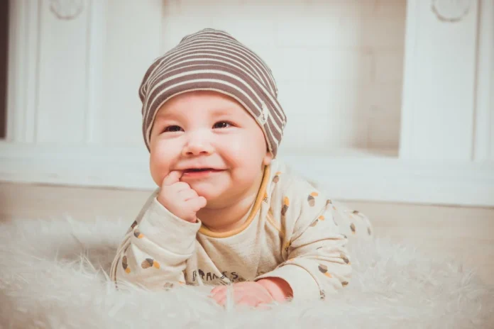 Smiling Baby Biting Right Index Finger // Healthier Baby Today