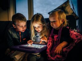 Three Children Looking at a Tablet Computer // Healthier Baby Today