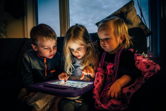 Three Children Looking at a Tablet Computer // Healthier Baby Today