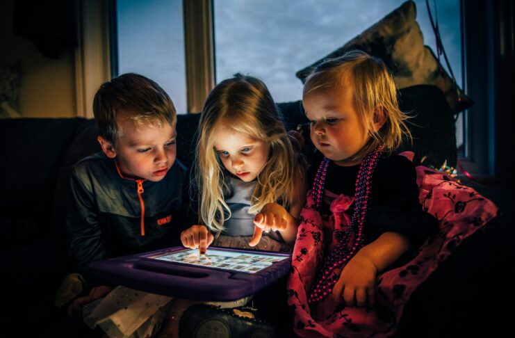 Three Children Looking at a Tablet Computer // Healthier Baby Today