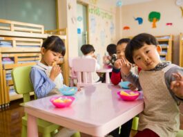 Three Toddler Eating on White Table at Day Care Center // Healthier Baby Today