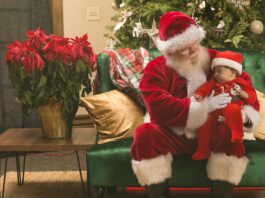 Baby's First Holidays, Santa Claus Holding a Young Child // Healthier Baby Today