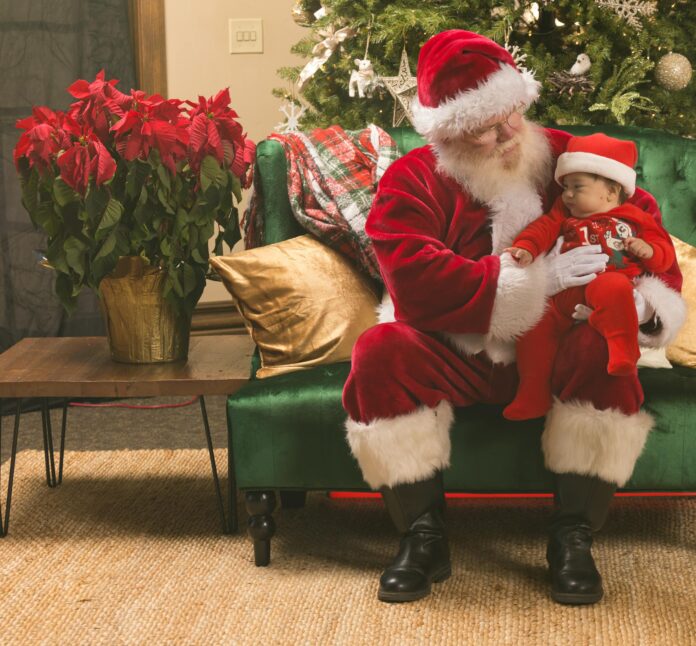 Baby's First Holidays, Santa Claus Holding a Young Child // Healthier Baby Today