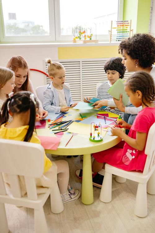 Children Sitting on Chairs in Front of Table With Art Materials // Healthier Baby Today