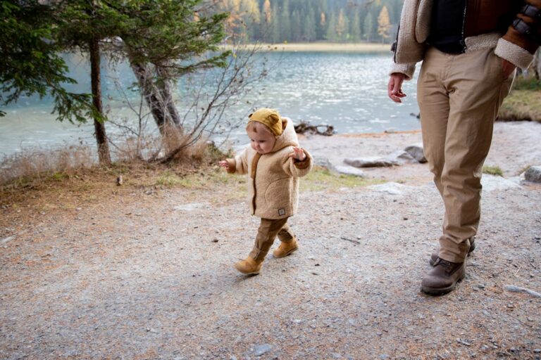 Photo Of Baby Walking and Wearing a Jacket // Healthier Baby Today