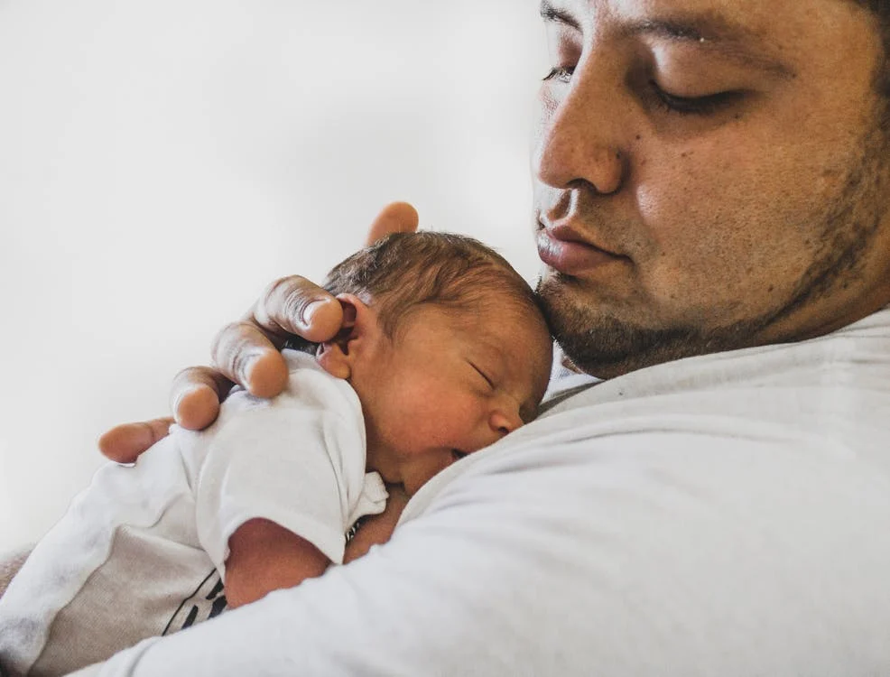 Parent-Infant Bonding, Photo Of Father Carrying Newborn Baby // Healthier Baby Today