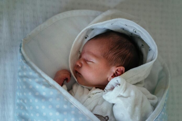 Baby in White and Blue Blanket // Healthier Baby Today