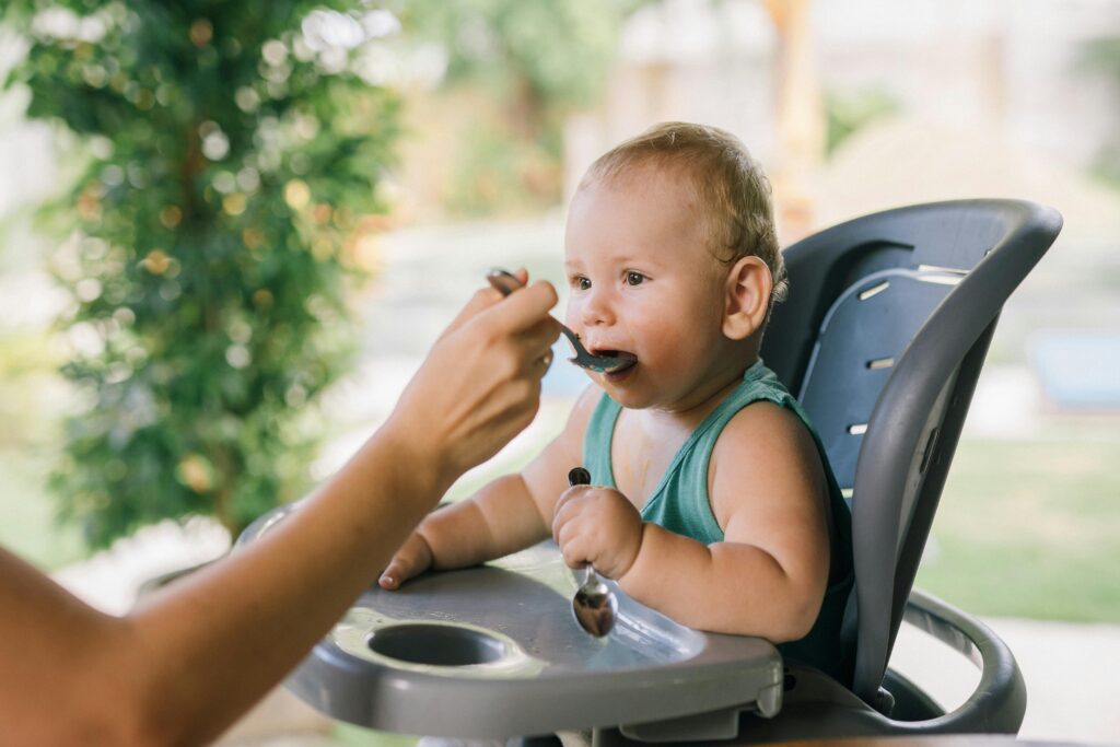 Photo Of Baby Eating On A Chair // Healthier Baby Today