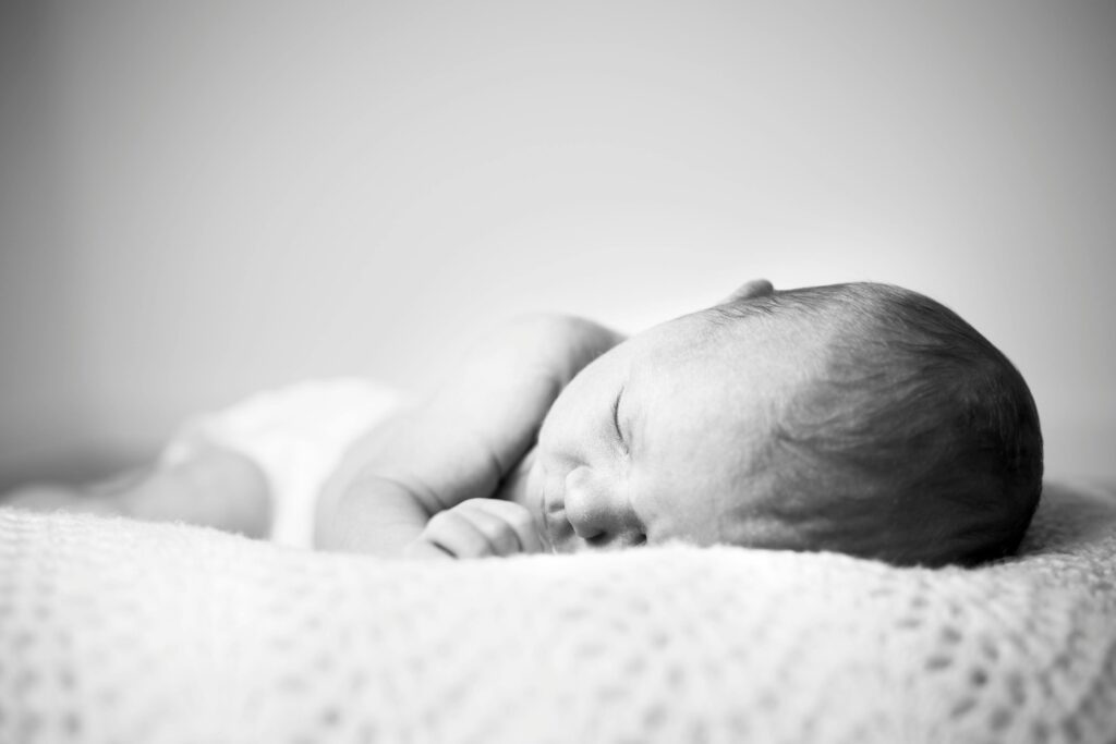 Grayscale Photo Of Baby Sleeping // Healthier Baby Today