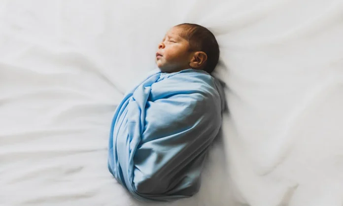 Baby Sleep Sack, Photo Of New Born Baby Covered With Blue Blanket // Healthier Baby Today