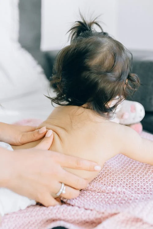 Photo of a Baby Getting a Back Massage // Healthier Baby Today