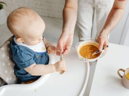 Baby Food Recipes, A Boy Holding a Spoon // Healthier Baby Today