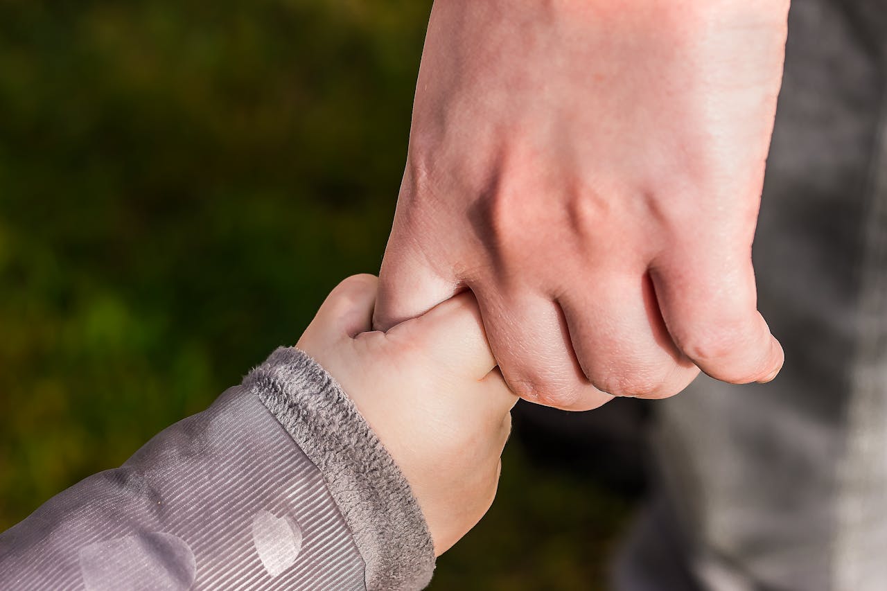 Child Holding Hand of Another Person // Healthier Baby Today