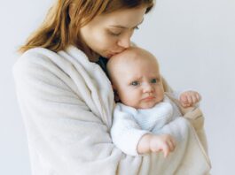 Loving Mother Kissing Her Cute Baby // Healthier Baby Today