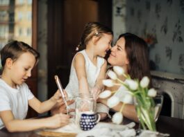 Which parenting style is most encouraged in modern america, Photo of Woman Playing With Her Children // Healthier Baby Today