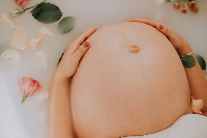 Having A Baby, Pregnant Woman Sitting on Bathtub // Healthier Baby Today