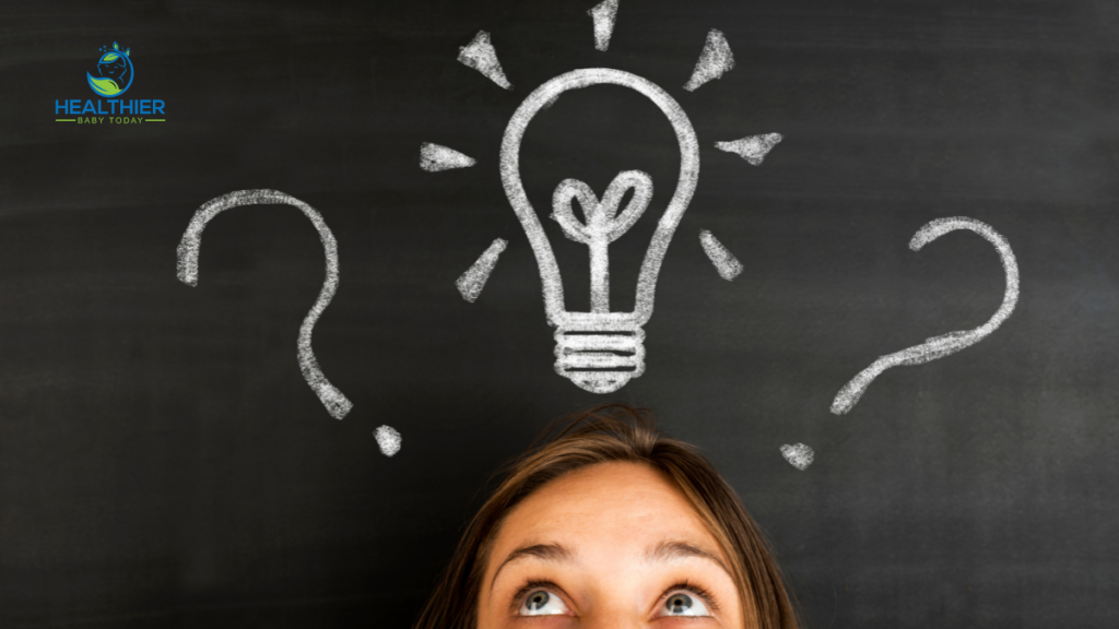 Lightbulb on chalkboard with a young girl looking at it // Healthier Baby Today