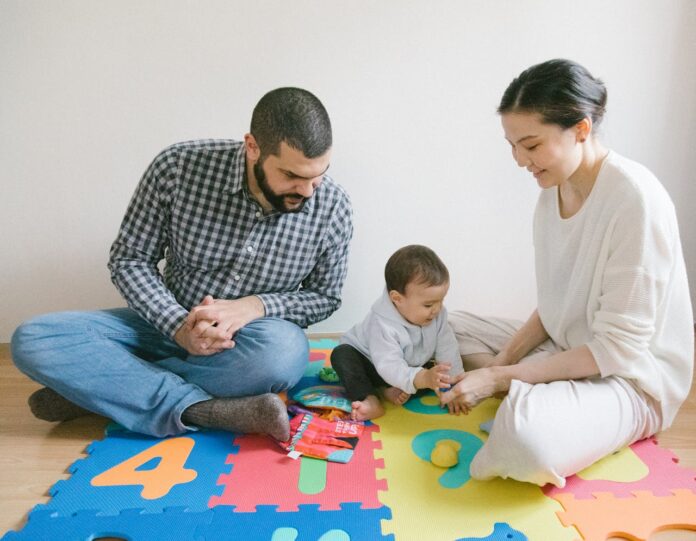 Family Playing on the Puzzle Mat // Healthier Baby Today