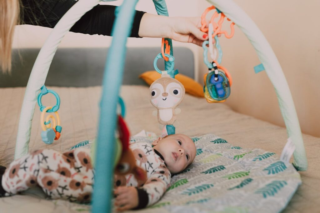 A Baby Lying on a Baby Bed // Healthier Baby Today