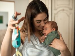 First Time Mom Must Haves, A Happy Woman Playing with her Baby // Healthier Baby Today