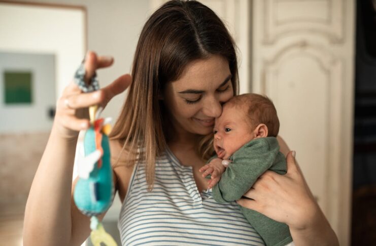 First Time Mom Must Haves, A Happy Woman Playing with her Baby // Healthier Baby Today