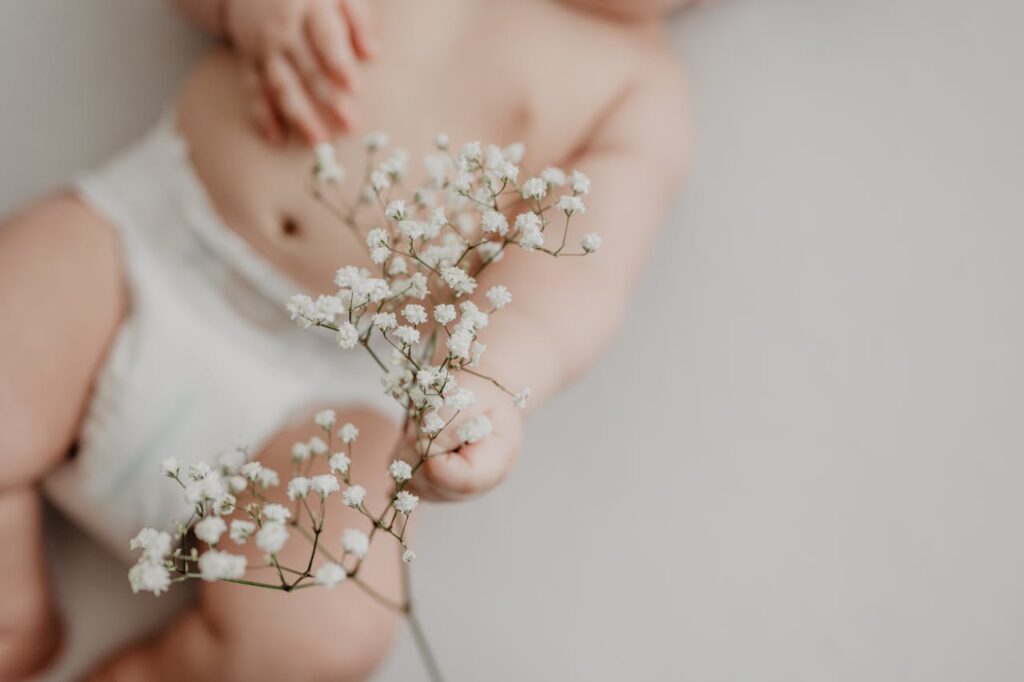 Baby Touching Delicate Flowers // Healthier Baby Today