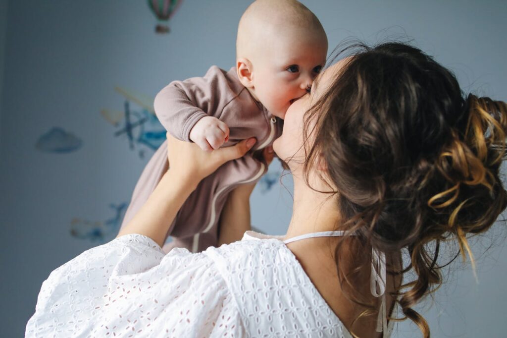 Mother Kissing Her Cute Baby // Healthier Baby Today
