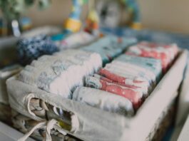 Stack of Money, Organized Diapers on Woven Basket // Healthier Baby Today