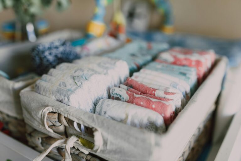 Stack of Money, Organized Diapers on Woven Basket // Healthier Baby Today