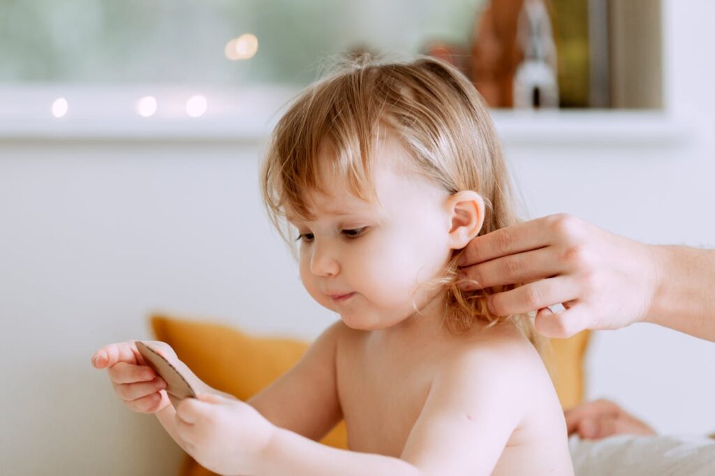 Photo Of Person Touching Baby's Hair // Healthier Baby Today