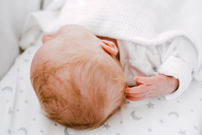 Photo of Baby Lying Down, Haircut for Newborns // Healthier Baby Today
