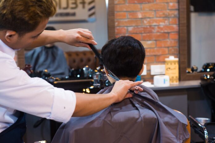 Barber Cutting Client Hair in Salon // Healthier Baby Today