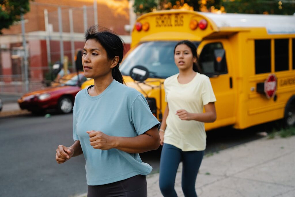 Mother and Daughter Out on a Run in City // Healthier Baby Today