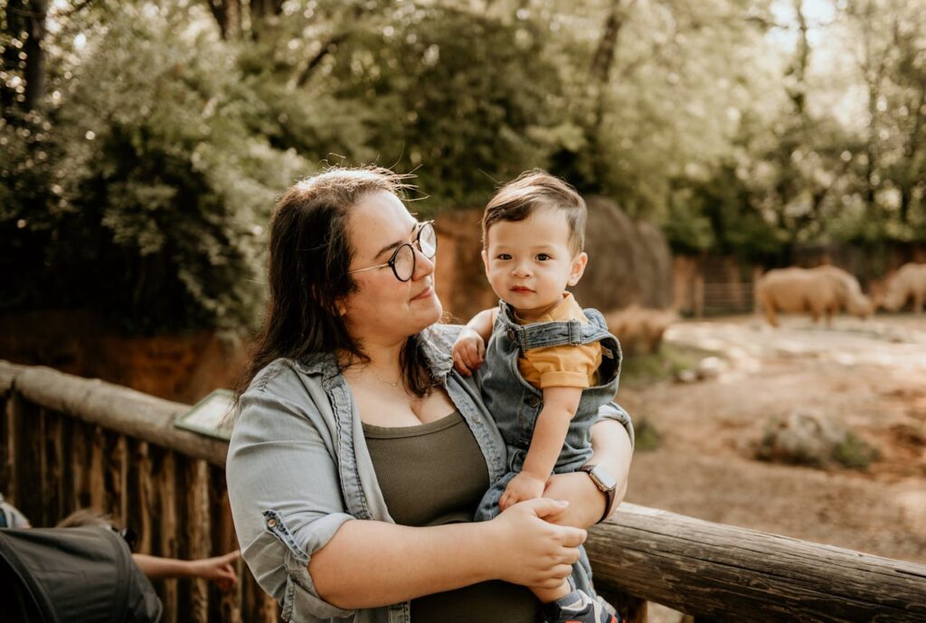 Woman Carrying a Her Son // Healthier Baby Today