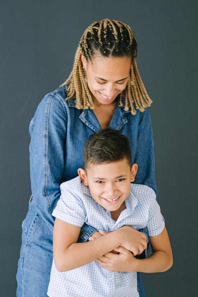 Woman Hugging Son From Behind // Healthier Baby Today