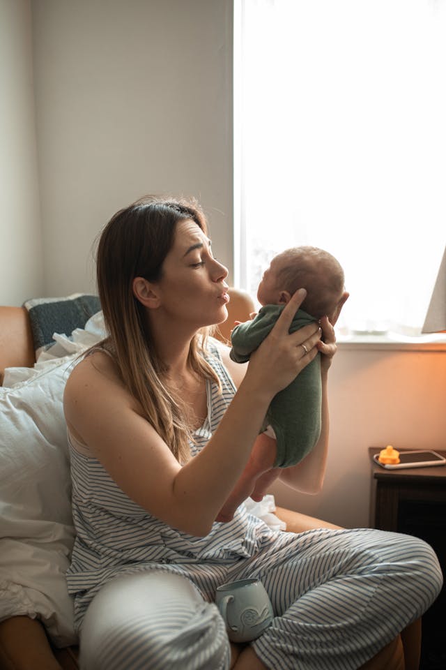 Woman Carrying Her Baby // Healthier Baby Today