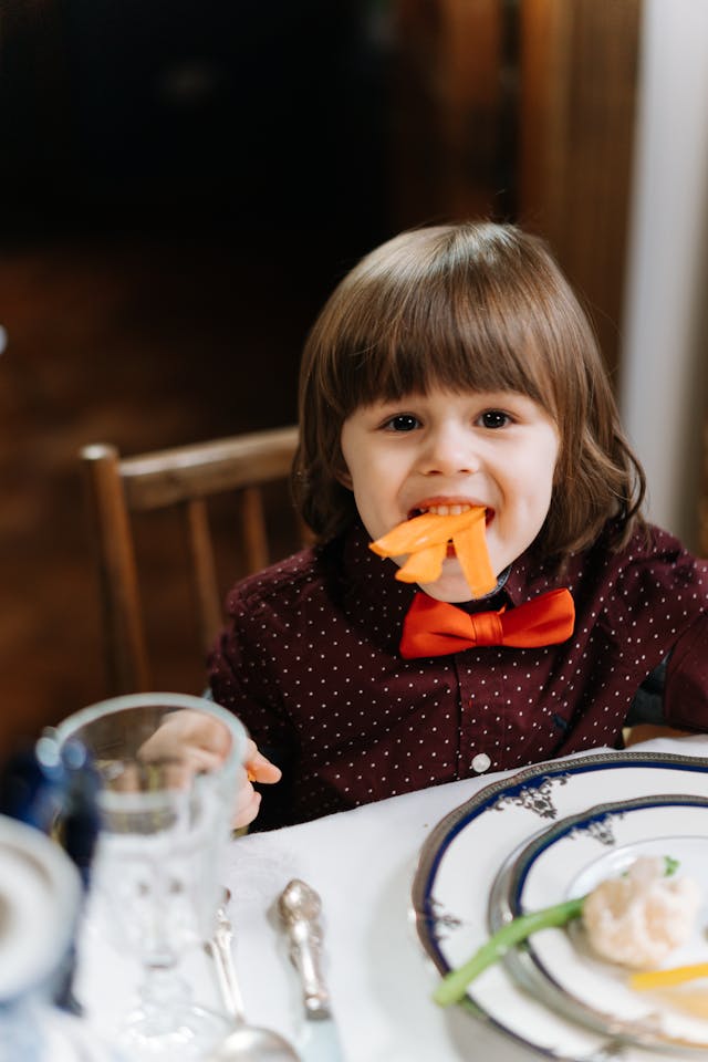 A Boy Eating Healthy Food at Dinner // Healthier Baby Today