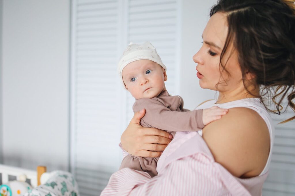 A Mother Carrying Her Cute Baby // Healthier Baby Today