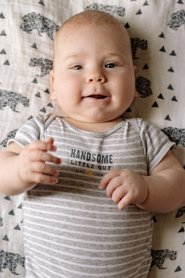 Baby in White and Gray Stripe Onesie // Healthier Baby Today