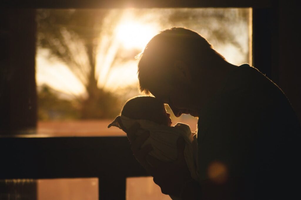 Man Carrying Baby Drawing Their Foreheads // Healthier Baby Today