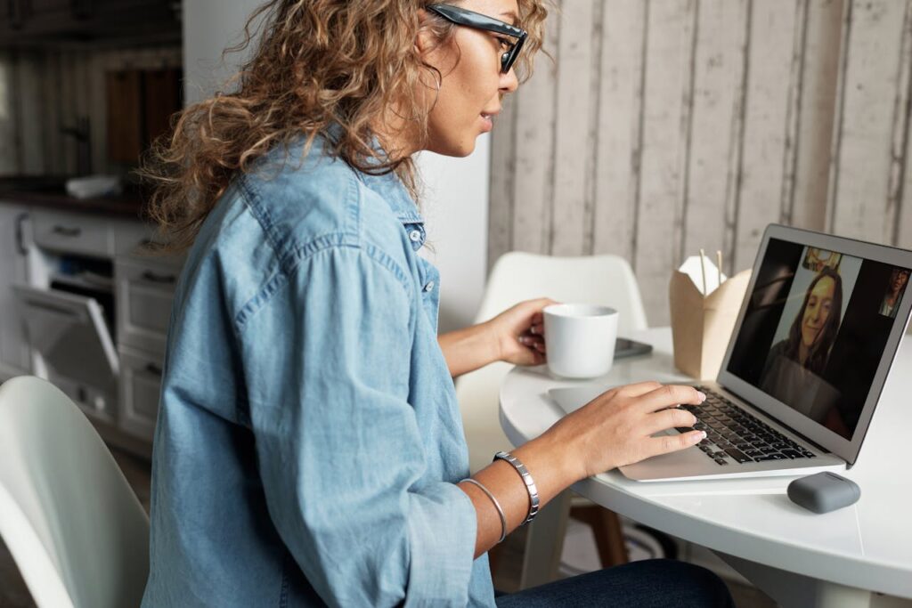 Woman in Blue Denim Jacket Using Macbook Pro // Healthier Baby Today