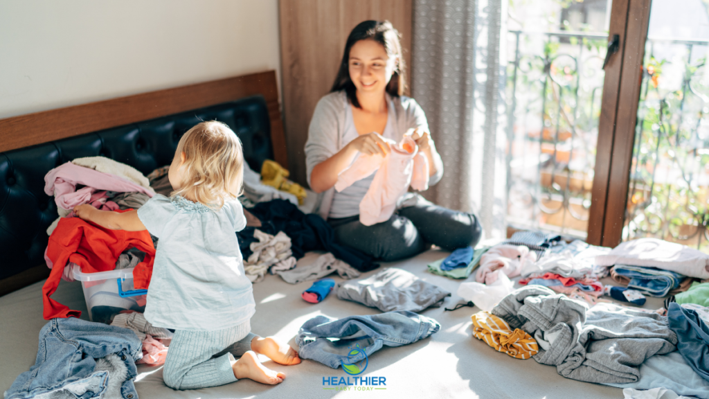 Mom folding clothes with toddler // Healthier Baby Today