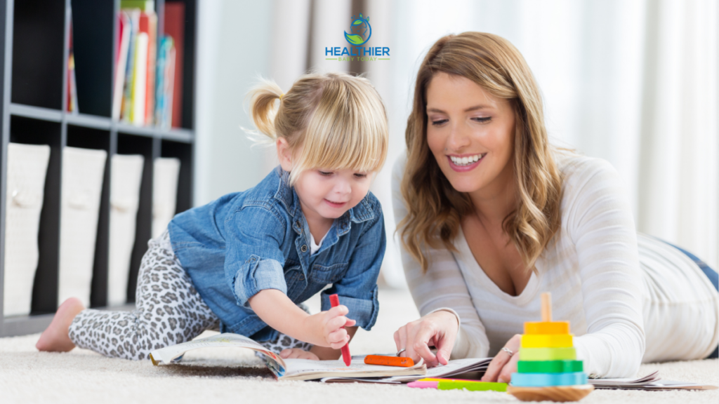 Mom sitting with toddler that is drawing // Healthier Baby Today