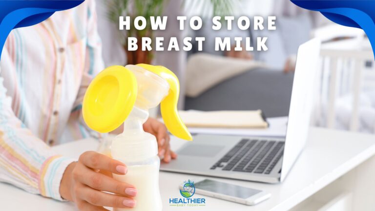 A woman in a striped shirt holding a manual breast pump filled with milk at a desk with a laptop in the background. Text reads: "How to Store Breast Milk" // Healthier Baby Today